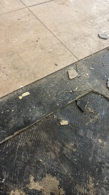Black bitumen mastic floor removal in a SW14 flat